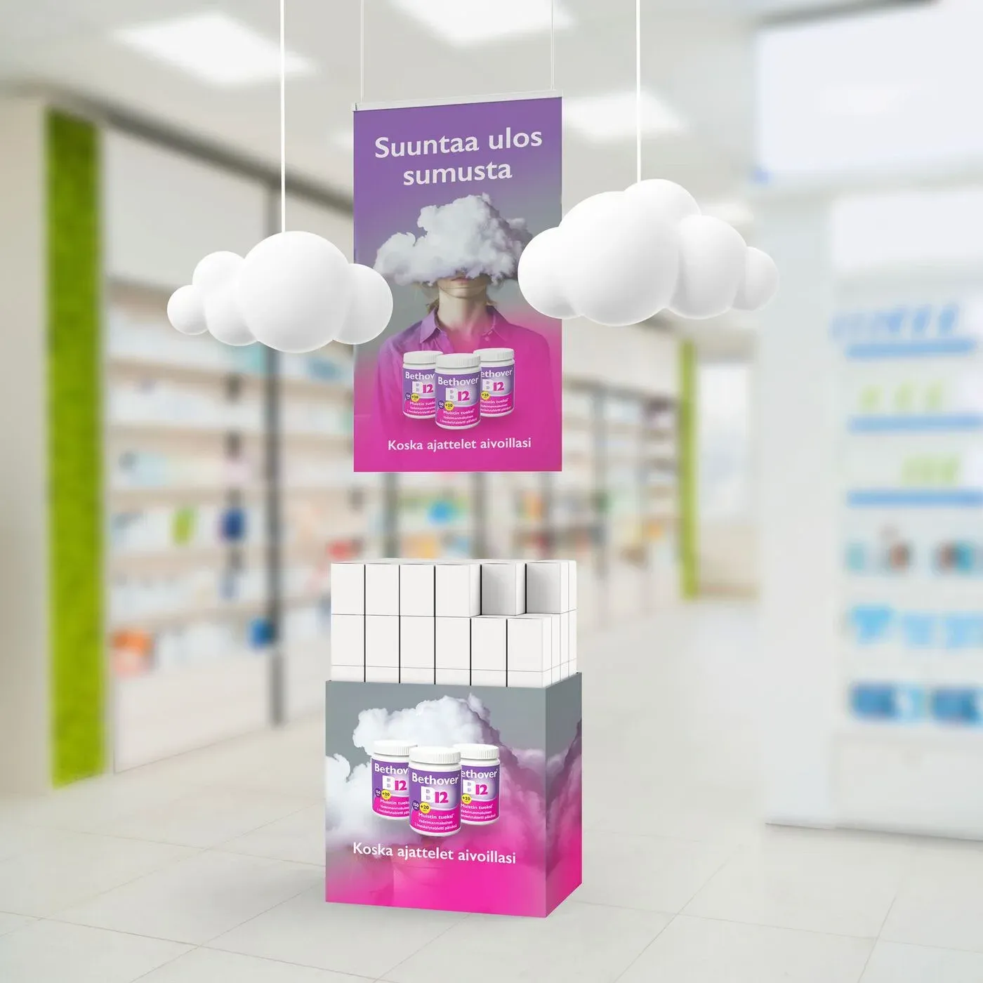 A pharmacy display with cotton cloud mobiles hanging above a Bethover stand.