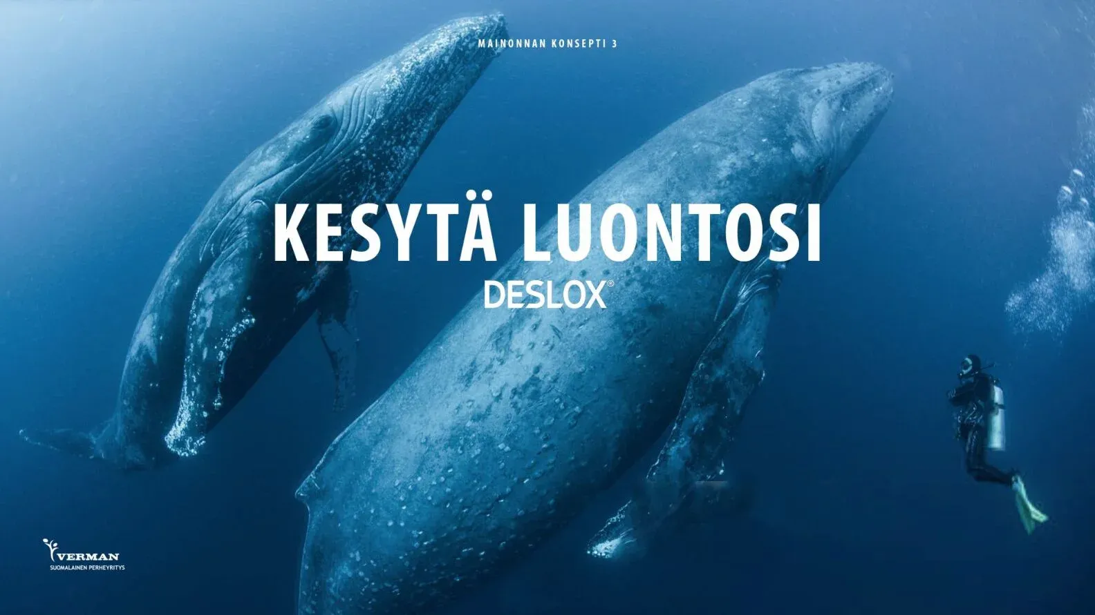 Two whales and a diver in deep blue water, with the line Kesytä luontosi and the Deslox logo.