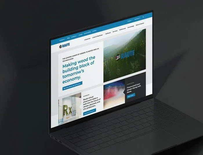 Laptop showing the raute.com homepage with the headline “Making wood the building block of tomorrow’s economy.” over a forest image.